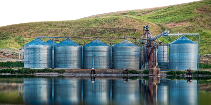 panoramic-shot-industrial-buildings-shore-lake-reflected-water_181624-19073