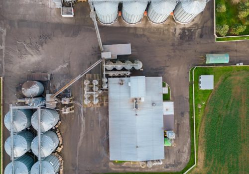 silver-silos-agro-manufacturing-plant-processing-drying-cleaning-storage-agricultural-products-flour-cereals-grain-flying-drone-iron-barrels-grain-quadcopter-photo_678914-7678